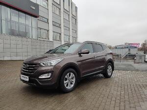 коричневый Hyundai Santa Fe 2.2d AT (197 л.с.) 4WD 2013
