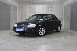 Черный Kia Spectra, I Рестайлинг 2 1.6 MT (101 л.с.) 2009