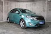 Зеленый Kia Rio 5-speed 1.6 MT (123 л.с.) 2014 фото 2