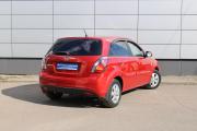 Красный Kia Rio 1.4 AT (95 л.с.) 2011 фото 5