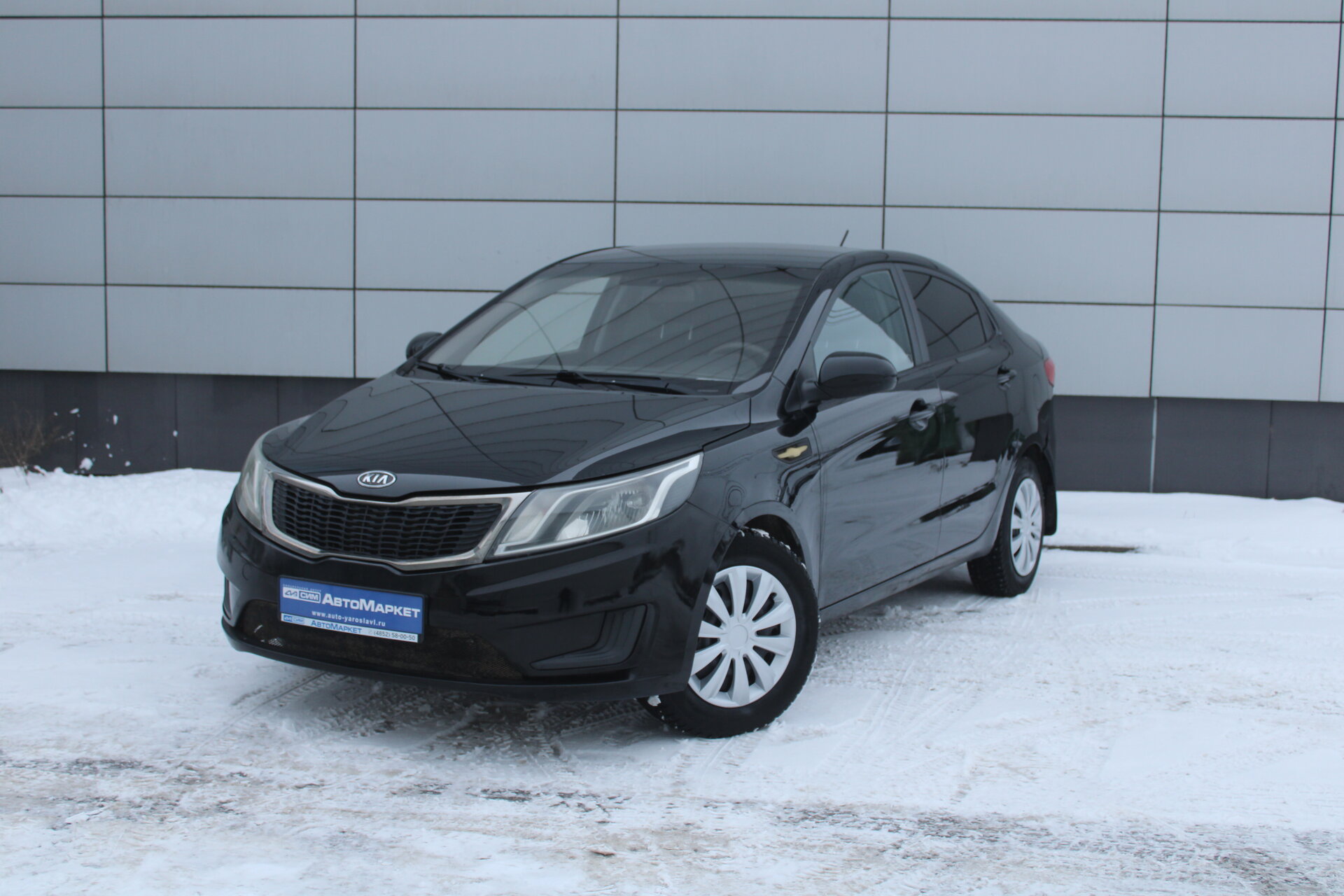 Черный Kia Rio, III 1.4 AT (107 л.с.) 2012