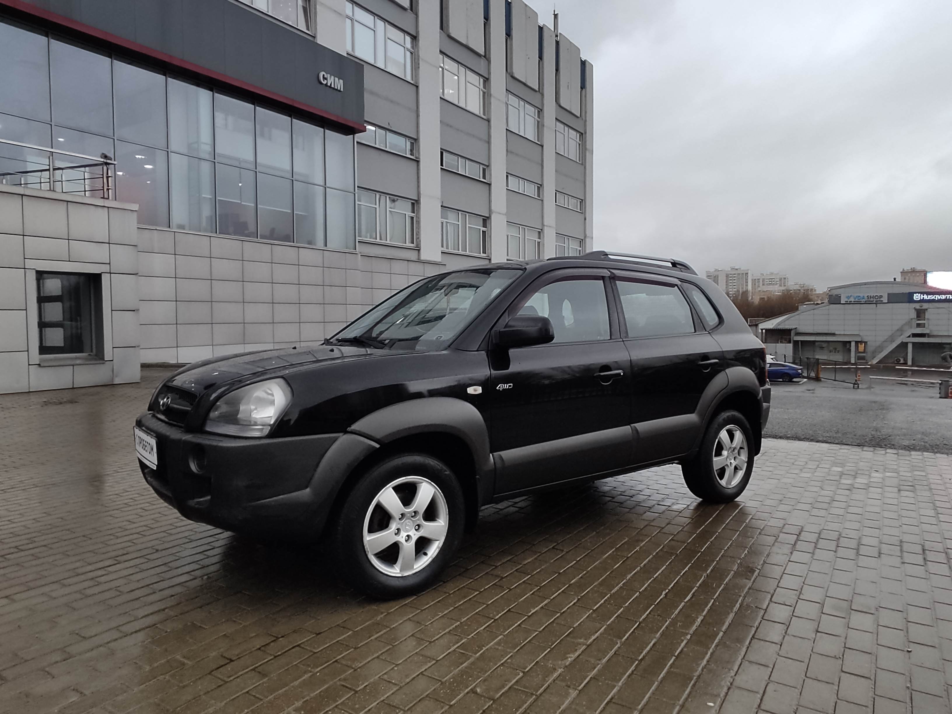 черный Hyundai Tucson 2.0 AT (141 л.с.) 4WD 2006