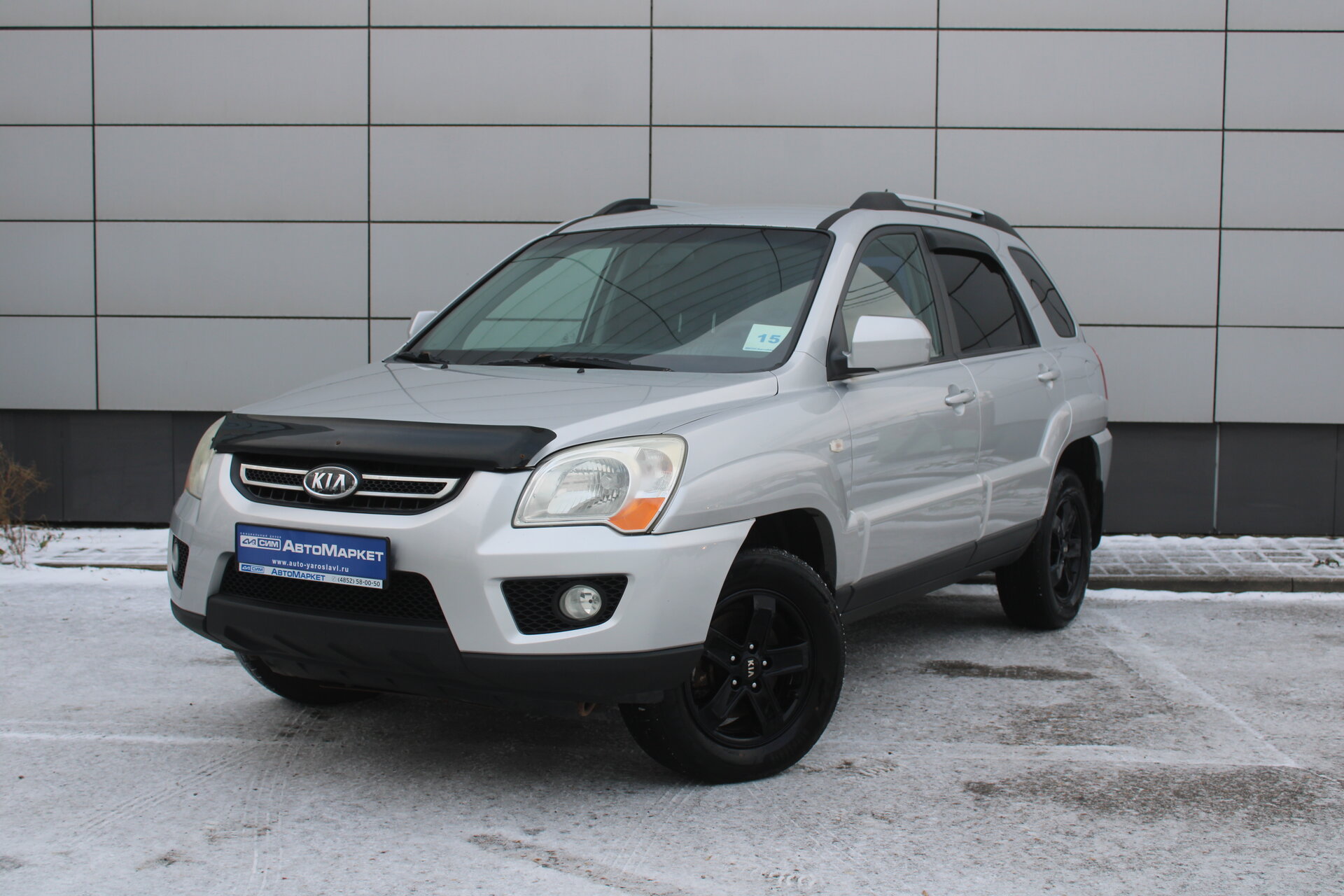 Серый Kia Sportage, II Рестайлинг 2.0 MT (141 л.с.) 4WD 2009