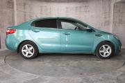 Зеленый Kia Rio 5-speed 1.6 MT (123 л.с.) 2014 фото 3