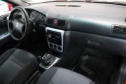 Красный Skoda Octavia 1.4 MT (75 л.с.) 2009 фото 10