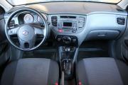 Красный Kia Rio 1.4 AT (95 л.с.) 2011 фото 8